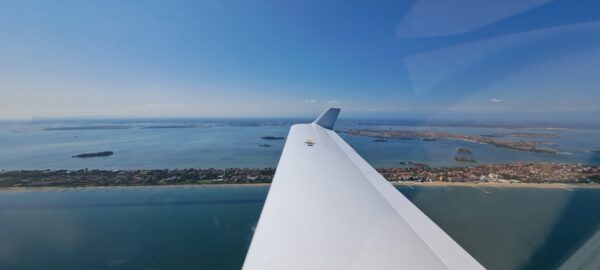 Venice (background) and Lido (foreground) after leaving the traffic pattern.